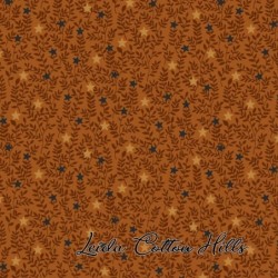 Tela para patchwork con estrellitas y ramitas sobre ocre ∙ Leida Cotton Hills