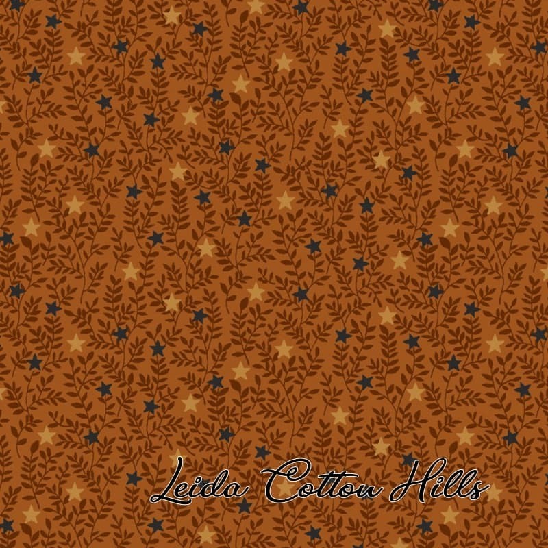 Tela para patchwork con estrellitas y ramitas sobre ocre ∙ Leida Cotton Hills