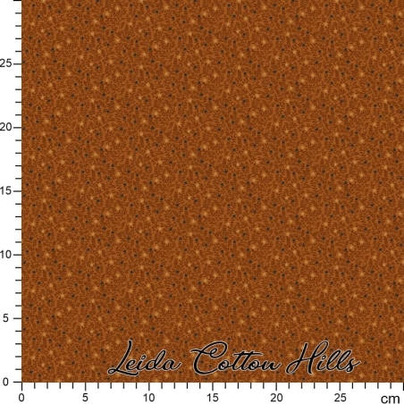 Tela para patchwork con estrellitas y ramitas sobre ocre